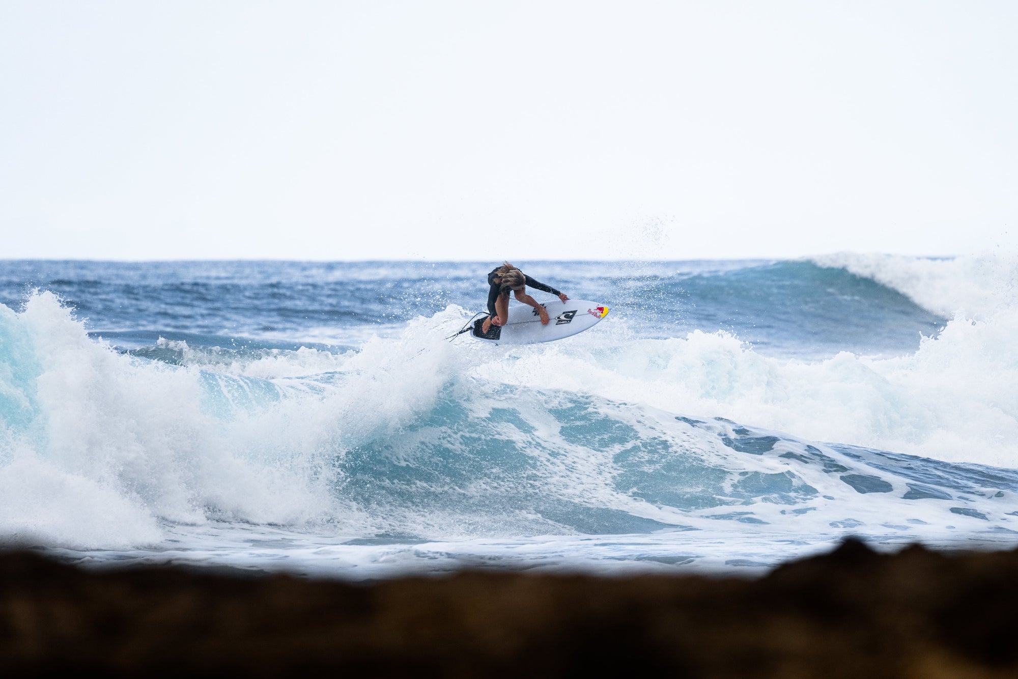 Nixon team member Caity Simmers surfs