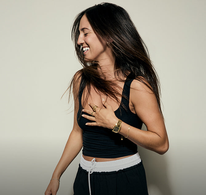Woman laughing while wearing the Nixon Frankie analog watch for women