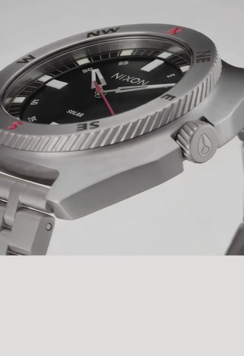 MP4 takedown of Nixon logo story showing different Nixon watches, pendulum, flames, on a gray background.